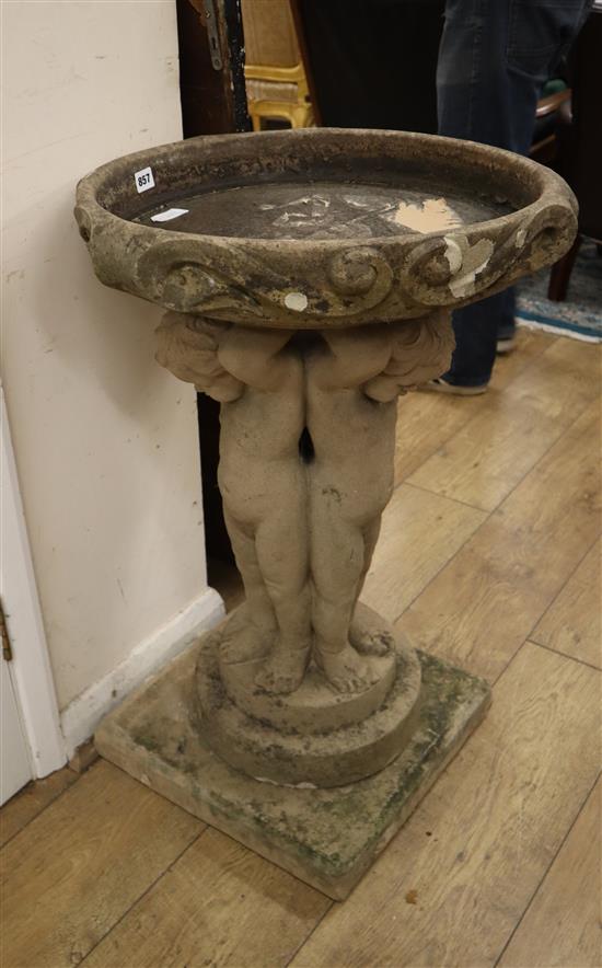 An early 20th century figural stone bird bath H.80cm